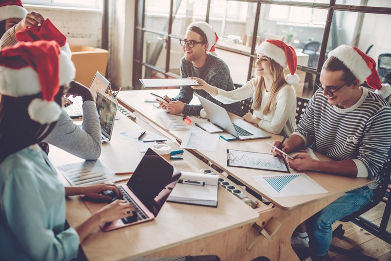 Motivated employees working at the office during the Holiday season